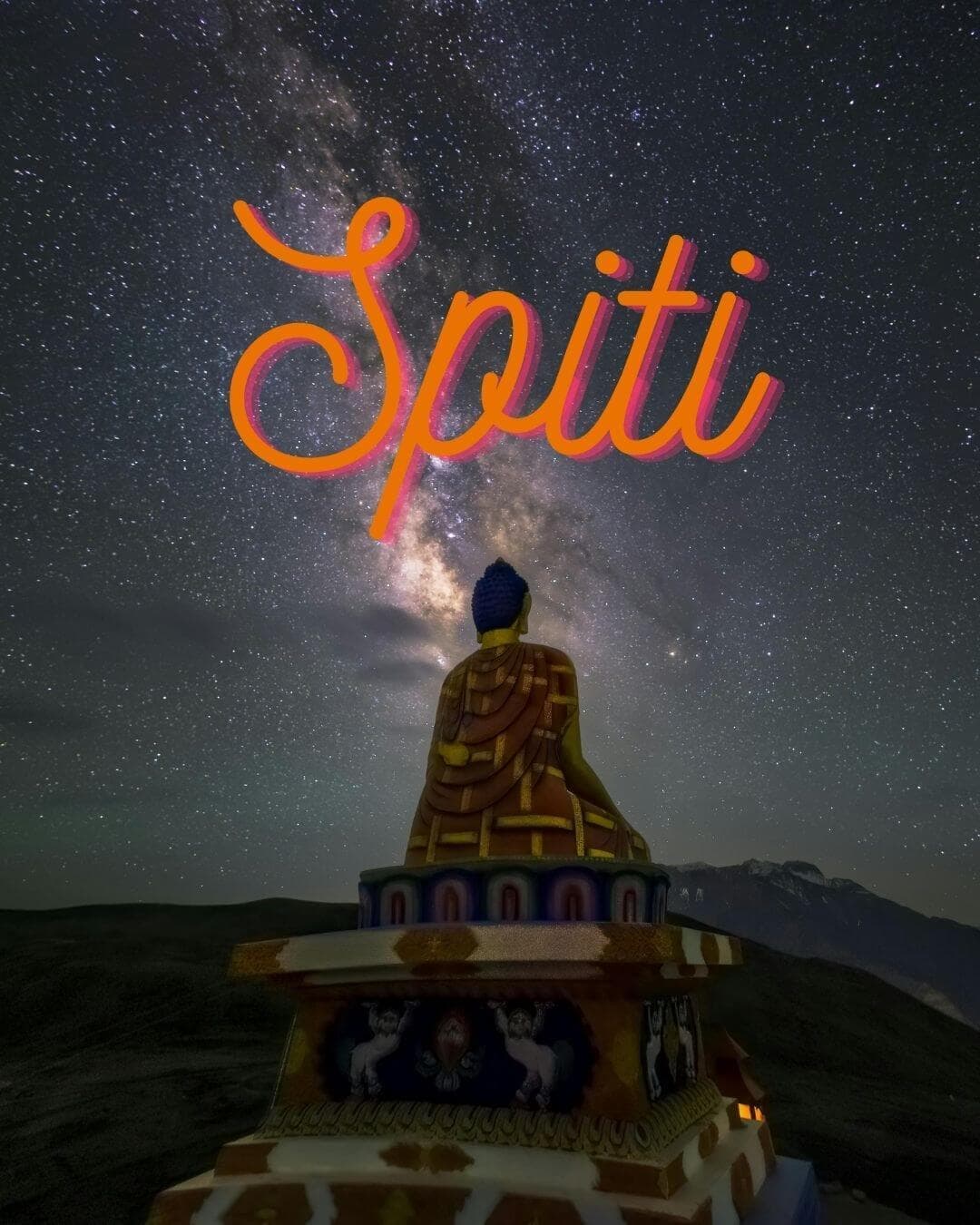 A Buddha statue silhouetted against the Milky Way over Spiti Valley at night